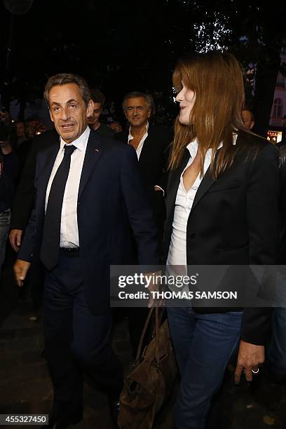 French former president Nicolas Sarkozy and his wife French singer Carla Bruni , followed by French writer and philosopher Bernard Henri-Levy ,...