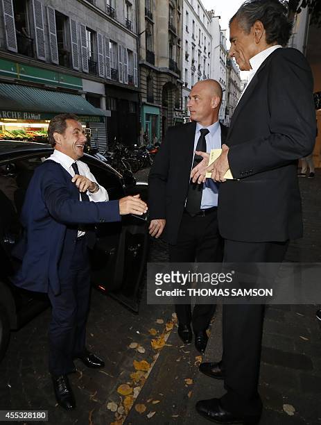 French former president Nicolas Sarkozy arrives to attend the premiere of the play "Hotel Europe" by French writer Bernard Henri-Levy on September...