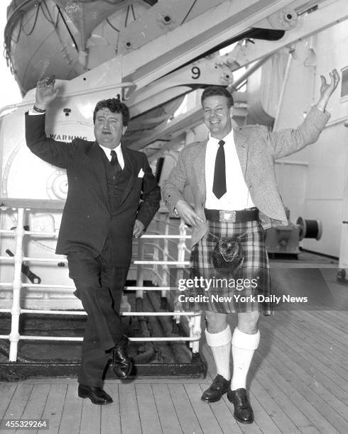Cunard Liner Queen Elizabeth arrives at Pier 90 Brendan Behan, noted Irish Playwright and his friend Dennis Clancy, of Dundee Scotland. Both do the...