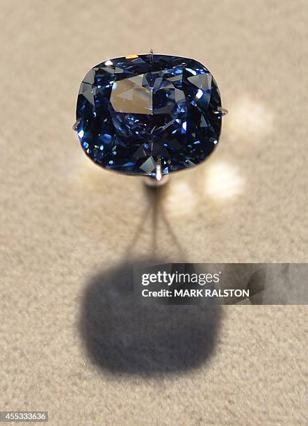 The priceless 12 carat "Blue Moon Diamond" is displayed at the Natural History Museum in Los Angeles on September 12, 2014. The extremely rare 'Fancy...