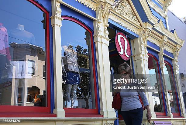 Pedestrian walks by a Lululemon retail store on September 12, 2014 in San Francisco, California. Athletic clothing retailer Lululemon Athletica Inc....