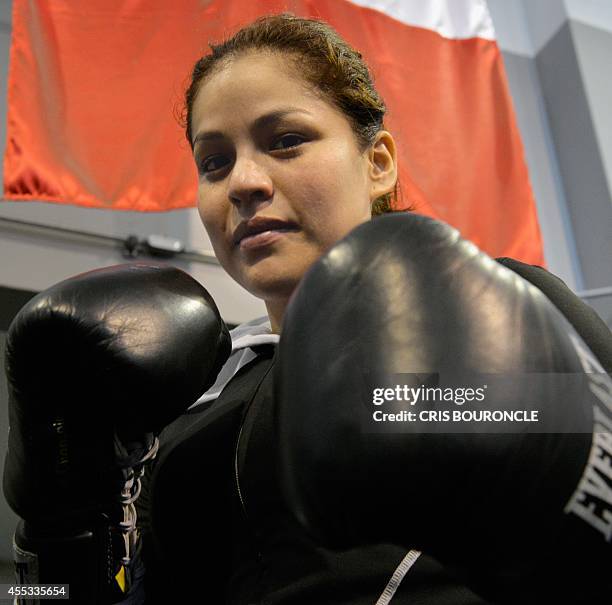 Peruvian female boxer Linda Lecca, AMB Light Flyweight World Champion, poses during a practice at the Peruvian Federation of Box gym in Lima on...