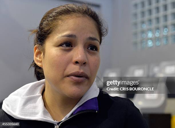 Peruvian female boxer Linda Lecca, AMB Light Flyweight World Champion, poses during a practice at the Peruvian Federation of Box gym in Lima on...