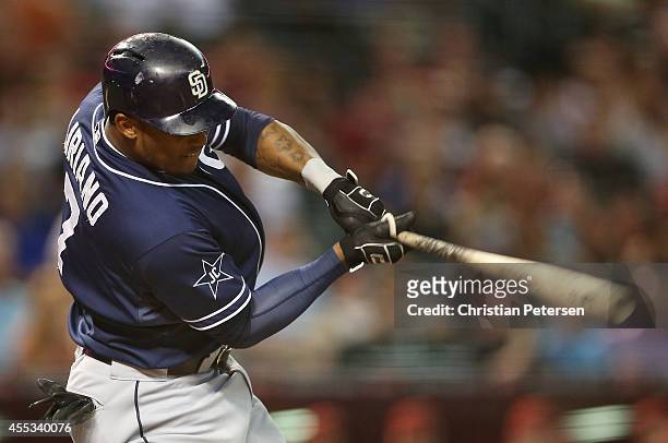 Rymer Liriano of the San Diego Padres hits a RBI on a fielder's choice during the second inning of the MLB game against the Arizona Diamondbacks at...