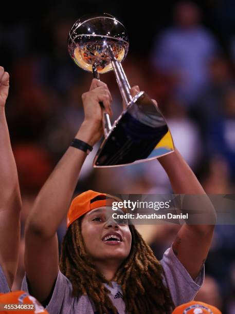 Brittney Griner of the Phoenix Mercury holds the championship trophy after a win over the Chicago Sky during game three of the WNBA Finals at the UIC...