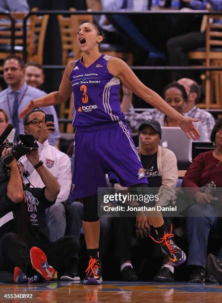 Diana Taurasi of the Phoenix Mercury celebrates hitting a shot and drawing a foul against the Chicago Sky during game three of the WNBA Finals at the...