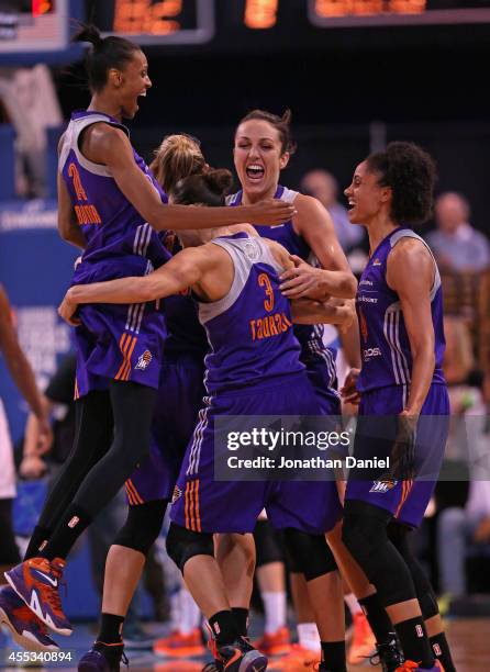 Members of the Phoenix Mercury including DeWanna Bonner, Diana Taurasi, Ewelina Kobryn and Candice Dupree celebrate a championship win over the...