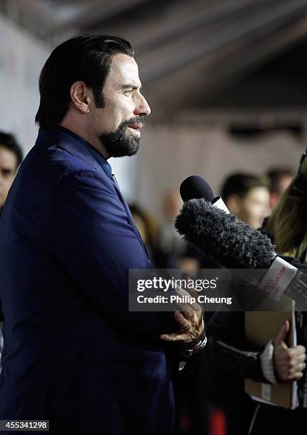 Actor John Travolta attends "The Forger" premiere during the 2014 Toronto International Film Festival at Roy Thomson Hall on September 12, 2014 in...