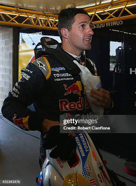 Jamie Whincup driver of the Red Bull Racing Australia Holden checks his time after qualifying for the Sandown 500, which is round ten of the V8...