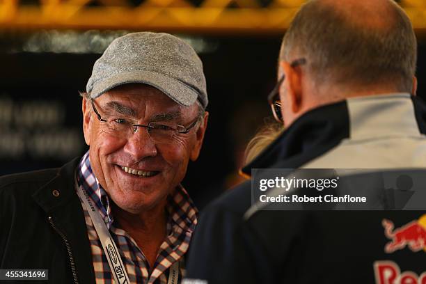 Former V8 driver Larry Perkins talks with Roland Dane during qualifying for the Sandown 500, which is round ten of the V8 Supercar Championship...