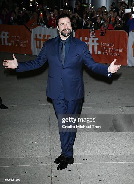 John Travolta arrives at the premiere of The Forger held during the 2014 Toronto International Film Festival - Day 9 on September 12, 2014 in...