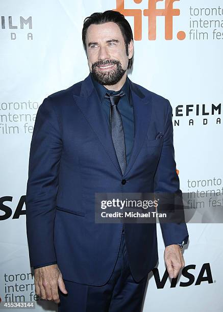 John Travolta arrives at the premiere of The Forger held during the 2014 Toronto International Film Festival - Day 9 on September 12, 2014 in...