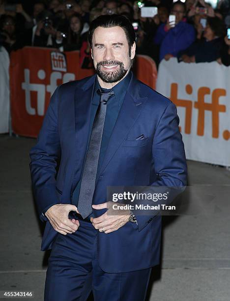 John Travolta arrives at the premiere of The Forger held during the 2014 Toronto International Film Festival - Day 9 on September 12, 2014 in...