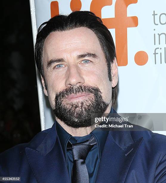 John Travolta arrives at the premiere of The Forger held during the 2014 Toronto International Film Festival - Day 9 on September 12, 2014 in...