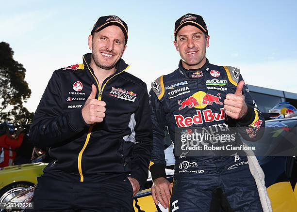 Paul Dumberell and Jamie Whincup drivers for the Bull Racing Australia Holden celebrate after taking pole position for the Sandown 500, which is...