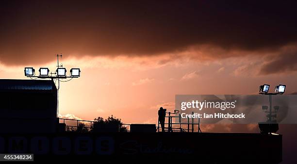 The sun is seen setting behind a television camera during the NRL 1st Elimination Final match between the North Queensland Cowboys and the Brisbane...