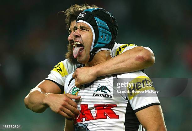 Jamie Soward of the Panthers celebrates his teams win with Josh Mansour during the NRL 1st Qualifying Final match between the Sydney Roosters and the...