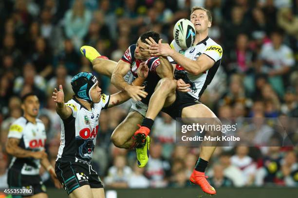 Anthony Minichiello of the Roosters and Matt Moylan of the Panthers compete for the high ball during the NRL 1st Qualifying Final match between the...