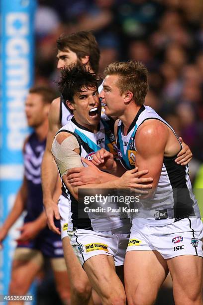 Angus Monfries and Ollie Wines of the Power celebrate a goal during the AFL 1st Semi Final match between the Fremantle Dockers and the Port Adelaide...