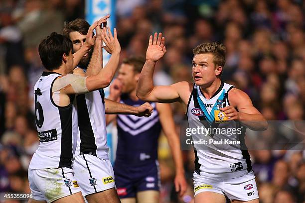 Angus Monfries and Ollie Wines of the Power celebrate a goal during the AFL 1st Semi Final match between the Fremantle Dockers and the Port Adelaide...