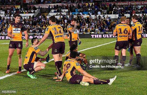 The Broncos gather together on the field after losing the NRL 1st Elimination Final match between the North Queensland Cowboys and the Brisbane...