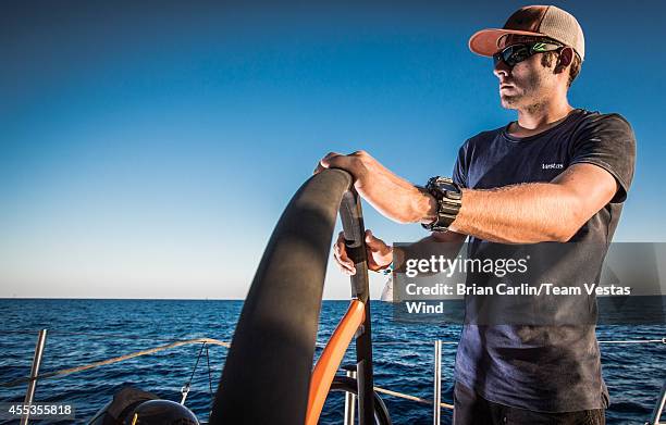 In this handout image provided by the Volvo Ocean Race, Tom Johnson driving keeping ADOR at arms lenght during Leg 0, a practice leg ahead of the...
