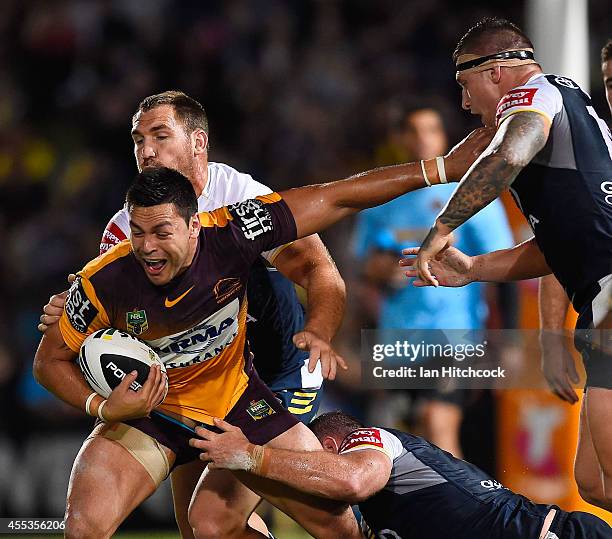 Jordan Kahu of the Broncos is wrapped up by the Cowboys defence during the NRL 1st Elimination Final match between the North Queensland Cowboys and...