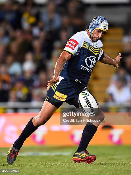 Johnathan Thurston of the Cowboys kicks the ball during the NRL 1st Elimination Final match between the North Queensland Cowboys and the Brisbane...