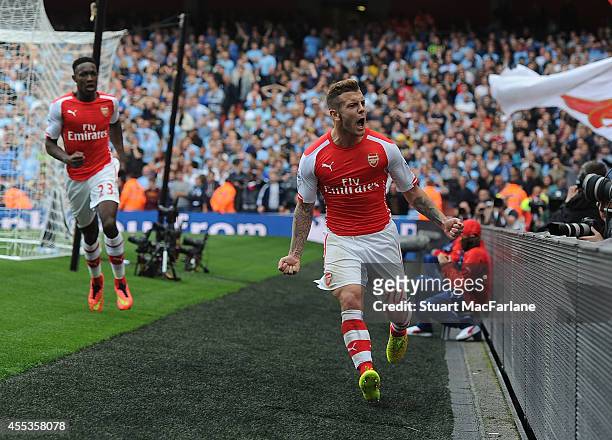 Jack Wilshere celebrates scoring for Arsenal during the Barclays Premier League match between Arsenal and Manchester City at Emirates Stadium on...