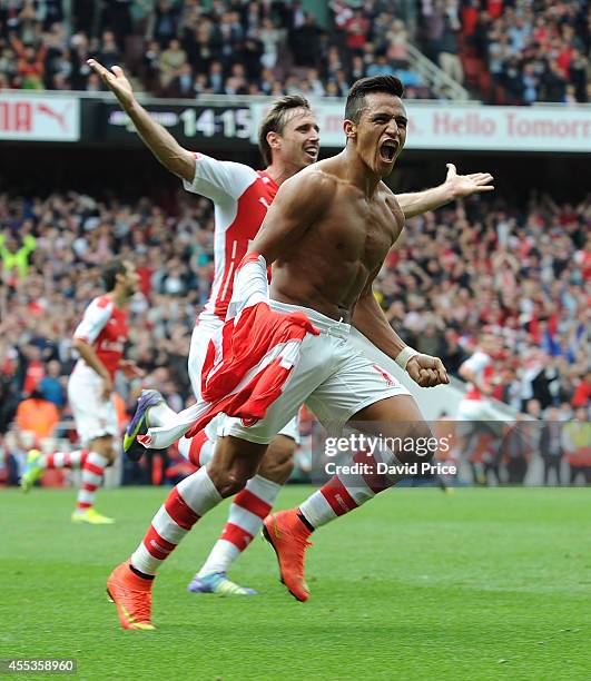 Alexis Sanchez celebrates scoring Arsenal's 2nd goal during the Barclays Premier League match between Arsenal and Manchester City at Emirates Stadium...