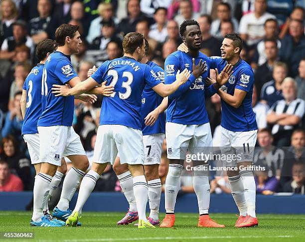 Romelu Lukaku of Everton celebrates scoring the opening goal with team mates during the Barclays Premier League match between West Bromwich Albion...