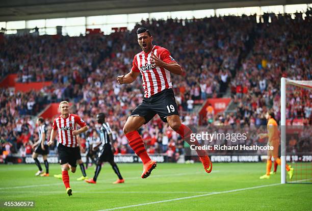 Graziano Pelle of Southampton celebrates as he scores their first goal during the Barclays Premier League match between Southampton and Newcastle...