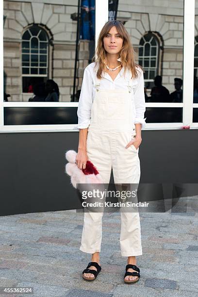 Model and TV Presenter Alexa Chung is wearing Birkenstock sandals and Chanel necklace on day 1 of London Collections: Women on September 12, 2014 in...