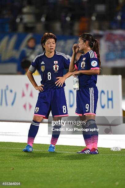 Aya Miyama of Japan and Nahomi Kawasumi of Japan discuss each other during the women's international friendly match between Japan and Ghana at ND...