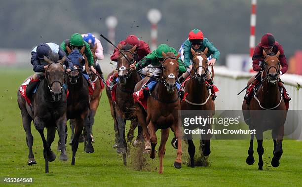 Andrea Atzeni riding Kingston Hill win The Ladbrokes St Leger Stakes at Doncaster racecourse on September 13, 2014 in Doncaster, England.