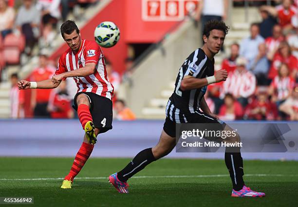 Morgan Schneiderlin of Southampton shoots past Daryl Janmaat of Newcastle United to score their fourth goal during the Barclays Premier League match...