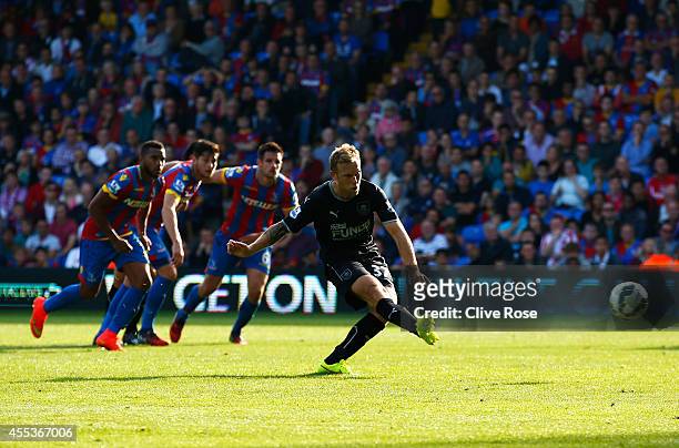 Scott Arfield of Burnley fails to score from the penalty spot during the Barclays Premier League match between Crystal Palace and Burnley at Selhurst...