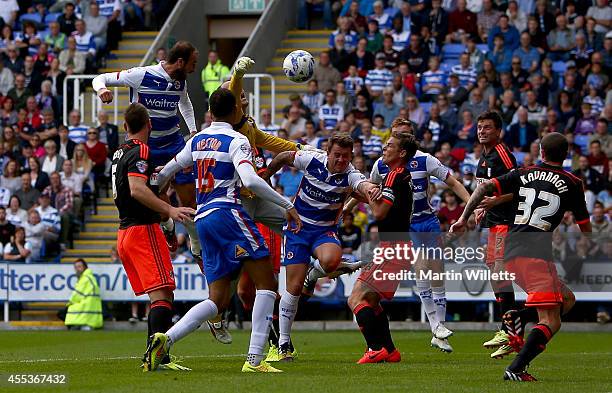 Glenn Murray of Reading beats Fulham's goakeeper Gabor Kiraly to the ball to scores his and Reading's second goal during the Sky Bet Championship...