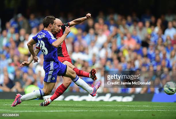 Jonjo Shelvey of Swansea City beats Cesar Azpilicueta of Chelsea to score their second goal during the Barclays Premier League match between Chelsea...