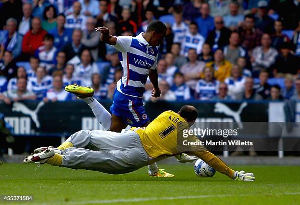Nick Blackman of Reading rounds Fulham's goakeeper Gabor Kiraly to score his sides third goal during the Sky Bet Championship match between Reading...