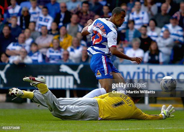 Nick Blackman of Reading rounds Fulham's goakeeper Gabor Kiraly to score his sides third goal during the Sky Bet Championship match between Reading...