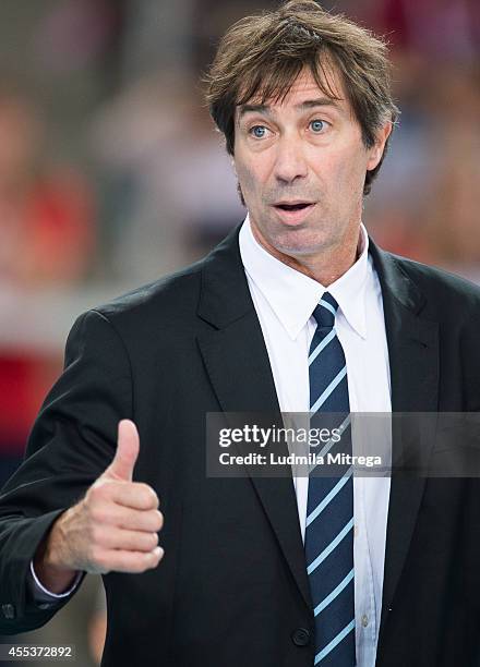 France's trainer coach Laurent Tillie reacts after winning point during the FIVB World Championships match between Serbia and France on September 13,...