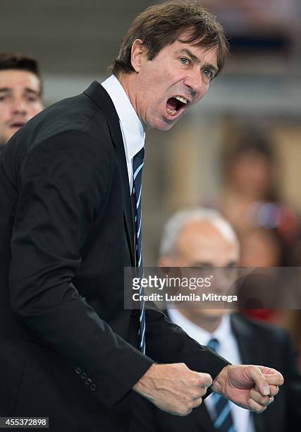 France's trainer coach Laurent Tillie reacts after winning point during the FIVB World Championships match between Serbia and France on September 13,...