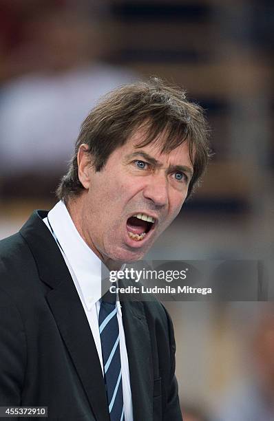 France's trainer coach Laurent Tillie reacts after winning point during the FIVB World Championships match between Serbia and France on September 13,...