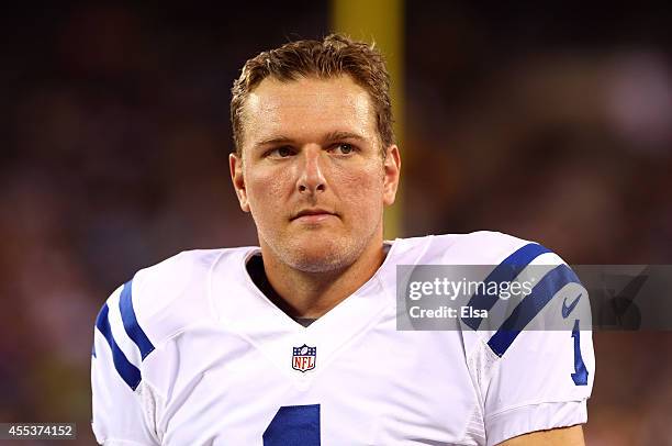 Punter Pat McAfee of the Indianapolis Colts looks on against the New York Jets during a preseason game at MetLife Stadium on August 7, 2014 in East...