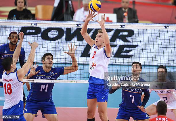 Serbia's Nikola Jovovic setting the ball during the FIVB World Championships match between Serbia and France on September 13, 2014 in Lodz, Poland.