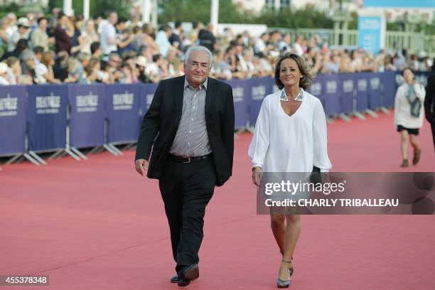 Former IMF chief Dominique Strauss-Kahn and his partner Media Marketing Executive Myriam L'Aouffir arrive to attend the closing ceremony of the 40th...