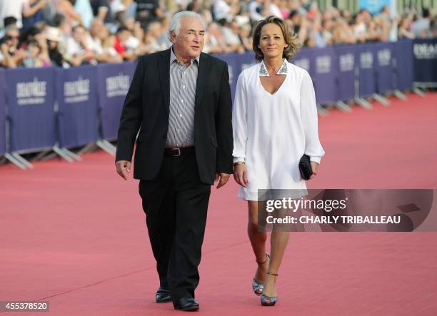 Former IMF chief Dominique Strauss-Kahn and his partner Media Marketing Executive Myriam L'Aouffir arrive to attend the closing ceremony of the 40th...