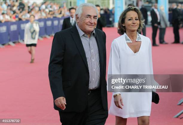 Former IMF chief Dominique Strauss-Kahn and his partner Media Marketing Executive Myriam L'Aouffir arrive to attend the closing ceremony of the 40th...