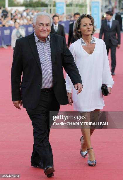 Former IMF chief Dominique Strauss-Kahn and his partner Media Marketing Executive Myriam L'Aouffir arrive to attend the closing ceremony of the 40th...